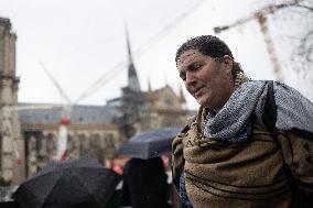 People attend the first mass outside Notre Dame Cathedral - Paris