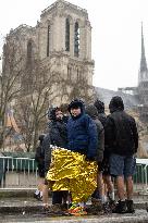 People attend the first mass outside Notre Dame Cathedral - Paris