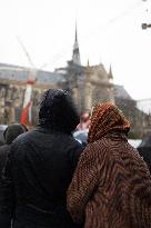 People attend the first mass outside Notre Dame Cathedral - Paris