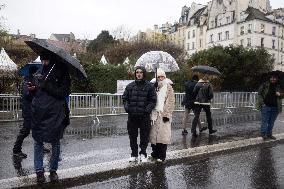 People attend the first mass outside Notre Dame Cathedral - Paris