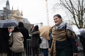 People attend the first mass outside Notre Dame Cathedral - Paris