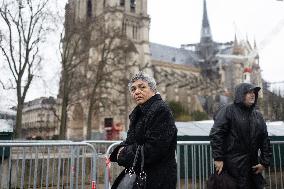 People attend the first mass outside Notre Dame Cathedral - Paris