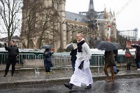 People attend the first mass outside Notre Dame Cathedral - Paris