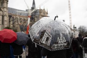 People attend the first mass outside Notre Dame Cathedral - Paris