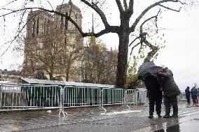 People attend the first mass outside Notre Dame Cathedral - Paris