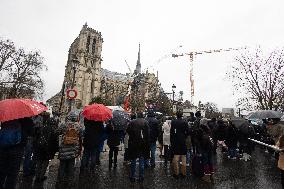 People attend the first mass outside Notre Dame Cathedral - Paris