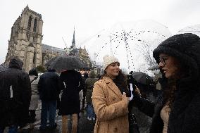 People attend the first mass outside Notre Dame Cathedral - Paris