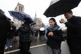 People attend the first mass outside Notre Dame Cathedral - Paris