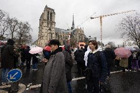 People attend the first mass outside Notre Dame Cathedral - Paris