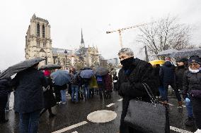 People attend the first mass outside Notre Dame Cathedral - Paris