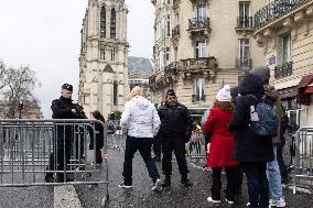 People attend the first mass outside Notre Dame Cathedral - Paris