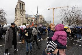 People attend the first mass outside Notre Dame Cathedral - Paris