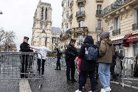 People attend the first mass outside Notre Dame Cathedral - Paris