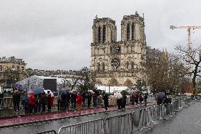 People attend the first mass outside Notre Dame Cathedral - Paris