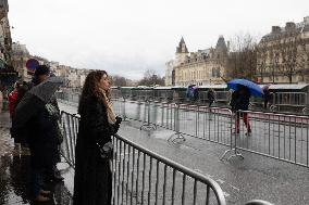 People attend the first mass outside Notre Dame Cathedral - Paris