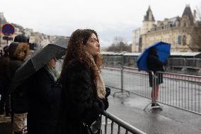 People attend the first mass outside Notre Dame Cathedral - Paris