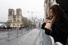 People attend the first mass outside Notre Dame Cathedral - Paris