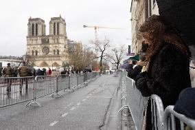 People attend the first mass outside Notre Dame Cathedral - Paris