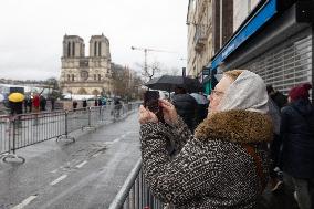 People attend the first mass outside Notre Dame Cathedral - Paris