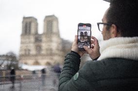 People attend the first mass outside Notre Dame Cathedral - Paris