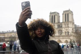 People attend the first mass outside Notre Dame Cathedral - Paris