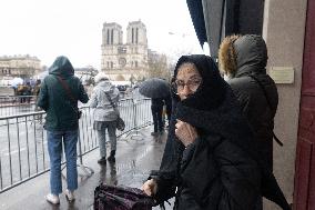 People attend the first mass outside Notre Dame Cathedral - Paris