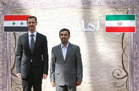 Mahmoud Ahmadinejad receives Bashar al-Assad in Tehran