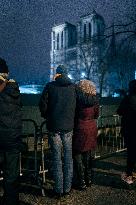 People attend the second mass outside Notre Dame Cathedral - Paris