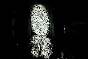 People attend the second mass outside Notre Dame Cathedral - Paris