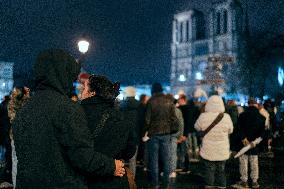 People attend the second mass outside Notre Dame Cathedral - Paris