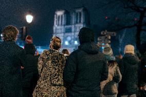 People attend the second mass outside Notre Dame Cathedral - Paris