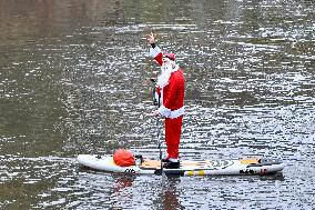 Santa Clauses Parade on Paddleboards - Strasbourg