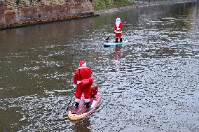 Santa Clauses Parade on Paddleboards - Strasbourg