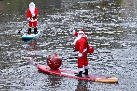 Santa Clauses Parade on Paddleboards - Strasbourg