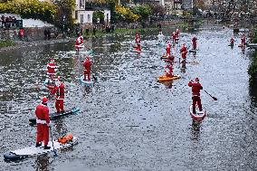 Santa Clauses Parade on Paddleboards - Strasbourg