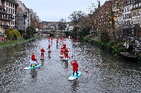 Santa Clauses Parade on Paddleboards - Strasbourg