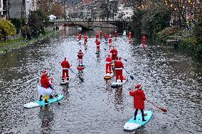 Santa Clauses Parade on Paddleboards - Strasbourg