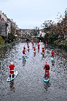 Santa Clauses Parade on Paddleboards - Strasbourg