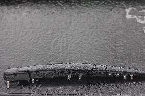 Freezing Rain Results In Surfaces Being Coated With A Sheet Of Ice In Toronto, Canada