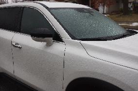 Freezing Rain Results In Surfaces Being Coated With A Sheet Of Ice In Toronto, Canada