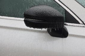 Freezing Rain Results In Surfaces Being Coated With A Sheet Of Ice In Toronto, Canada