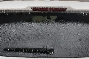 Freezing Rain Results In Surfaces Being Coated With A Sheet Of Ice In Toronto, Canada