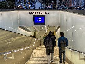 Evening Commuters Entering Suburban Train Station Rosenheimer Platz In Munich