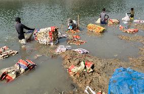 Cement Bags Washed In The Heavy Polluted Surma River - Bangladesh