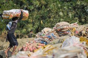 Cement Bags Washed In The Heavy Polluted Surma River - Bangladesh