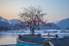 Tourists Enjoy An Outdoor Hot Spring - China