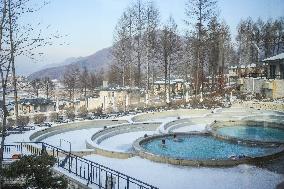 Tourists Enjoy An Outdoor Hot Spring - China