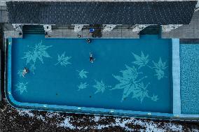 Tourists Enjoy An Outdoor Hot Spring - China