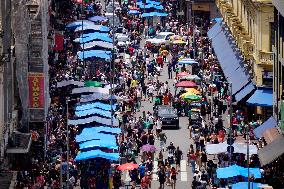 Consumers Are Busy Shopping For Christmas At Ladeira Porto Geral In SP