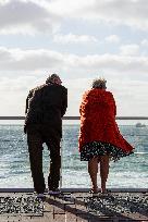 Elderly Couple On The Promenad